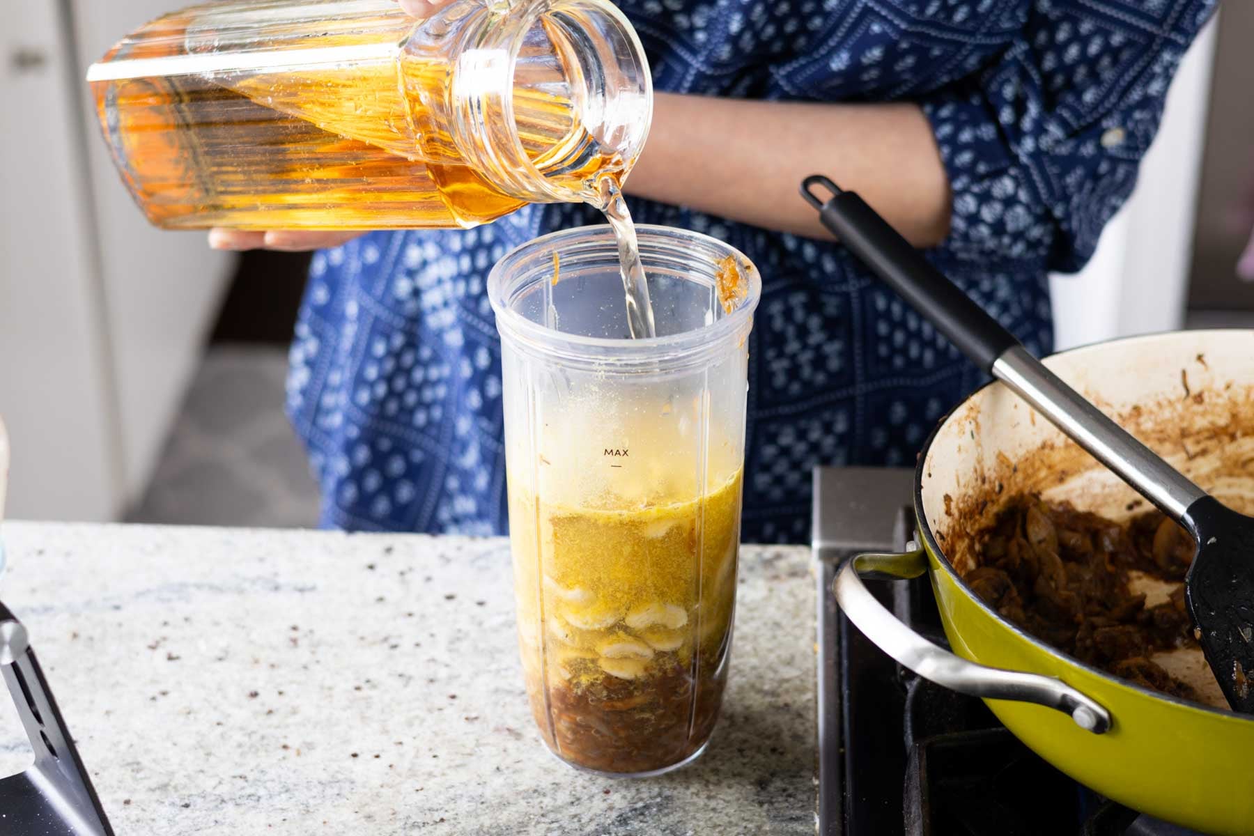 adding stock to the blender
