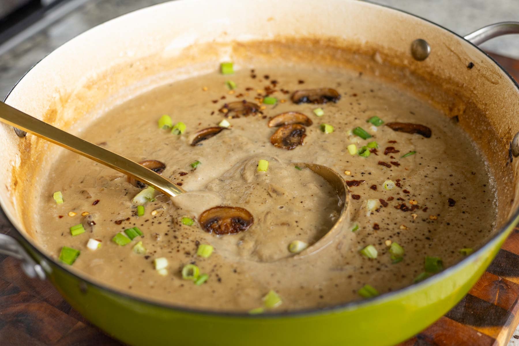 cream of mushroom soup in the pan, topped with reserved mushrooms