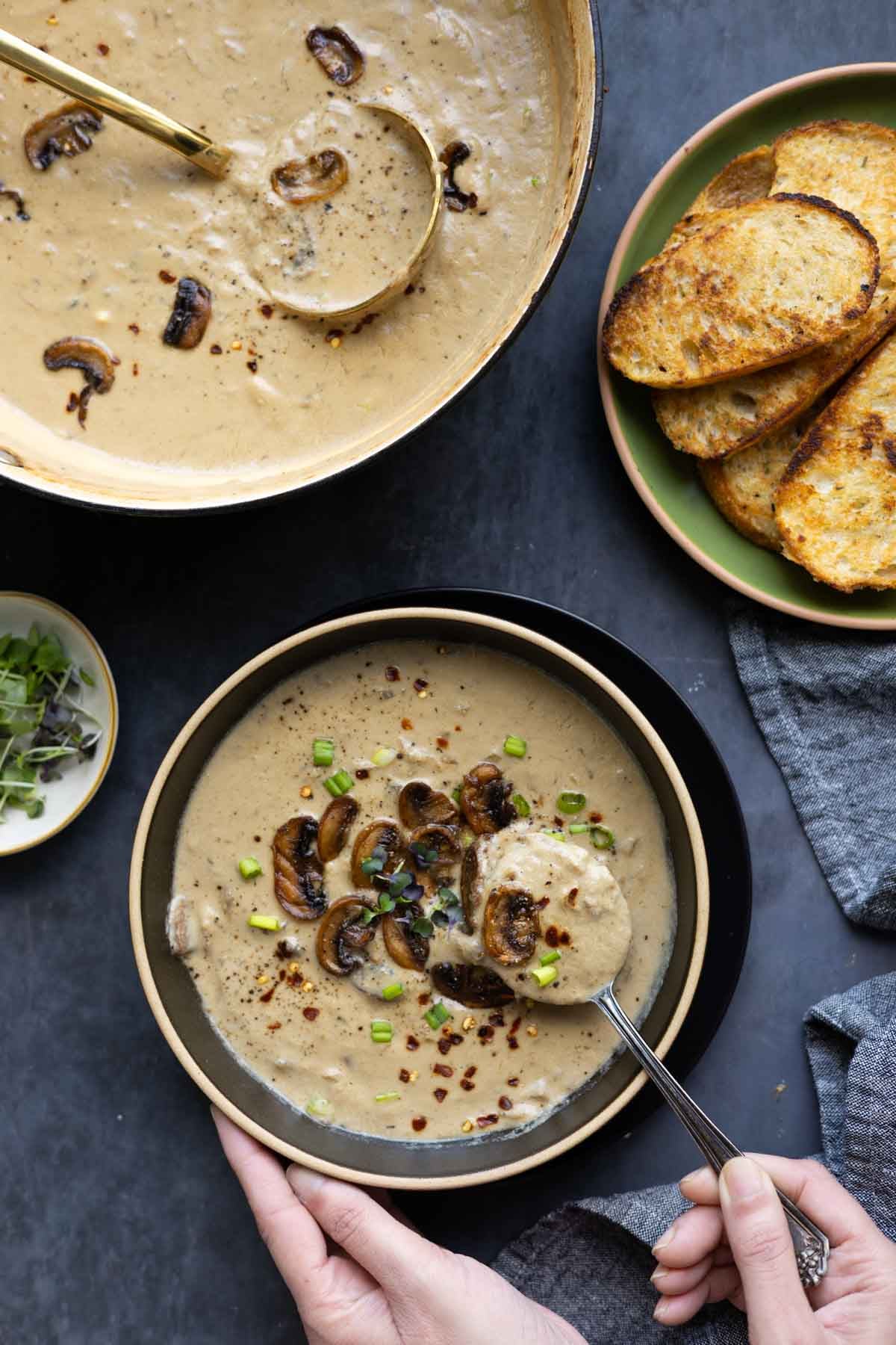 taking a bite of cream of mushroom soup