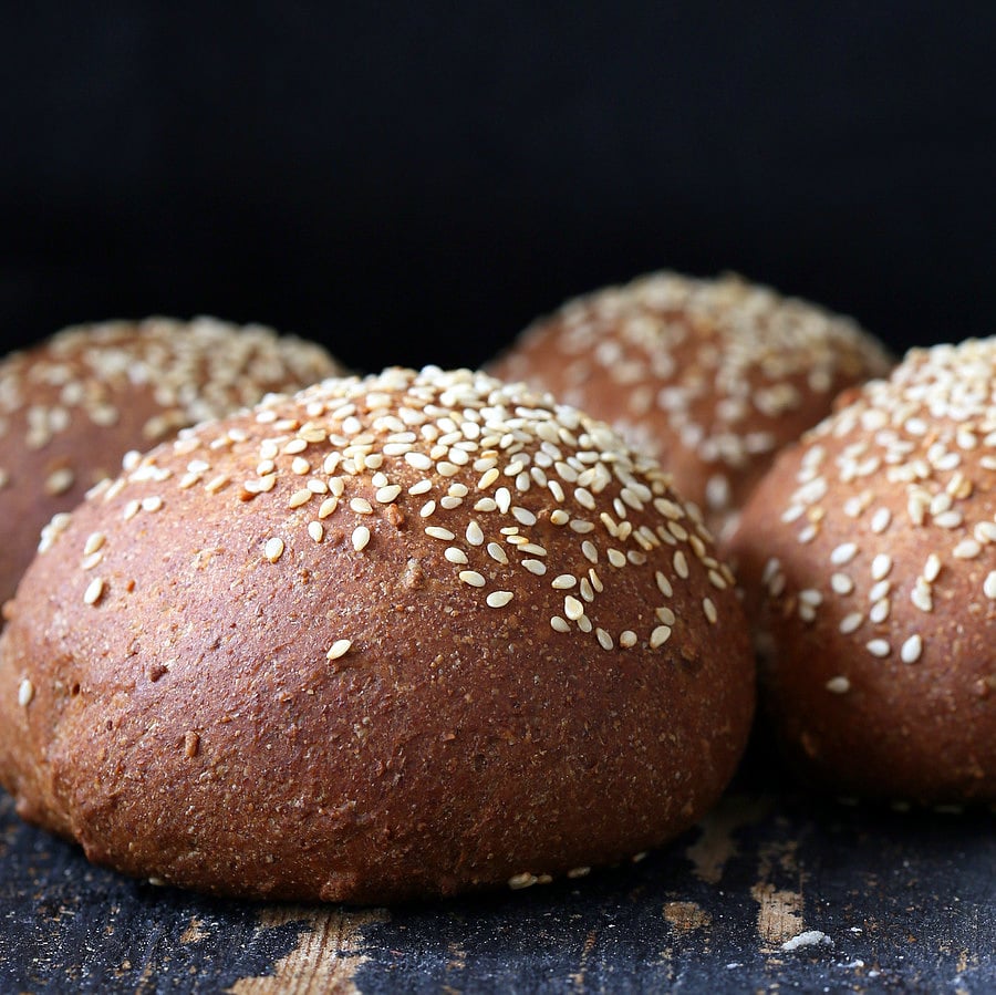 vegan burger buns side view of vegan burger buns sprinkled with sesame seeds