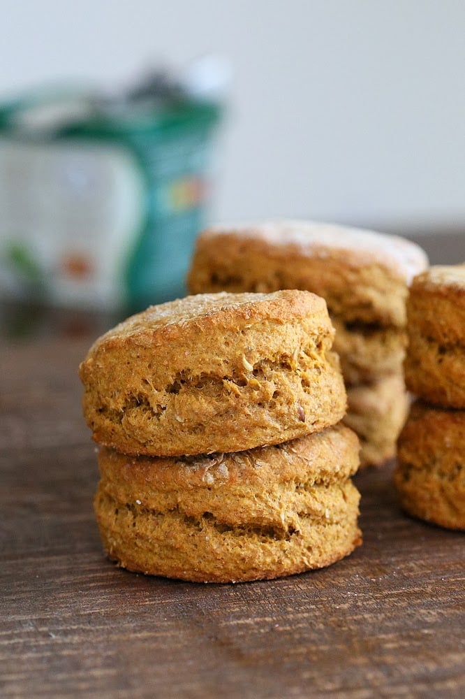 sweet potato biscuits side view of stacked healthy vegan sweet potato biscuits on a wooden board