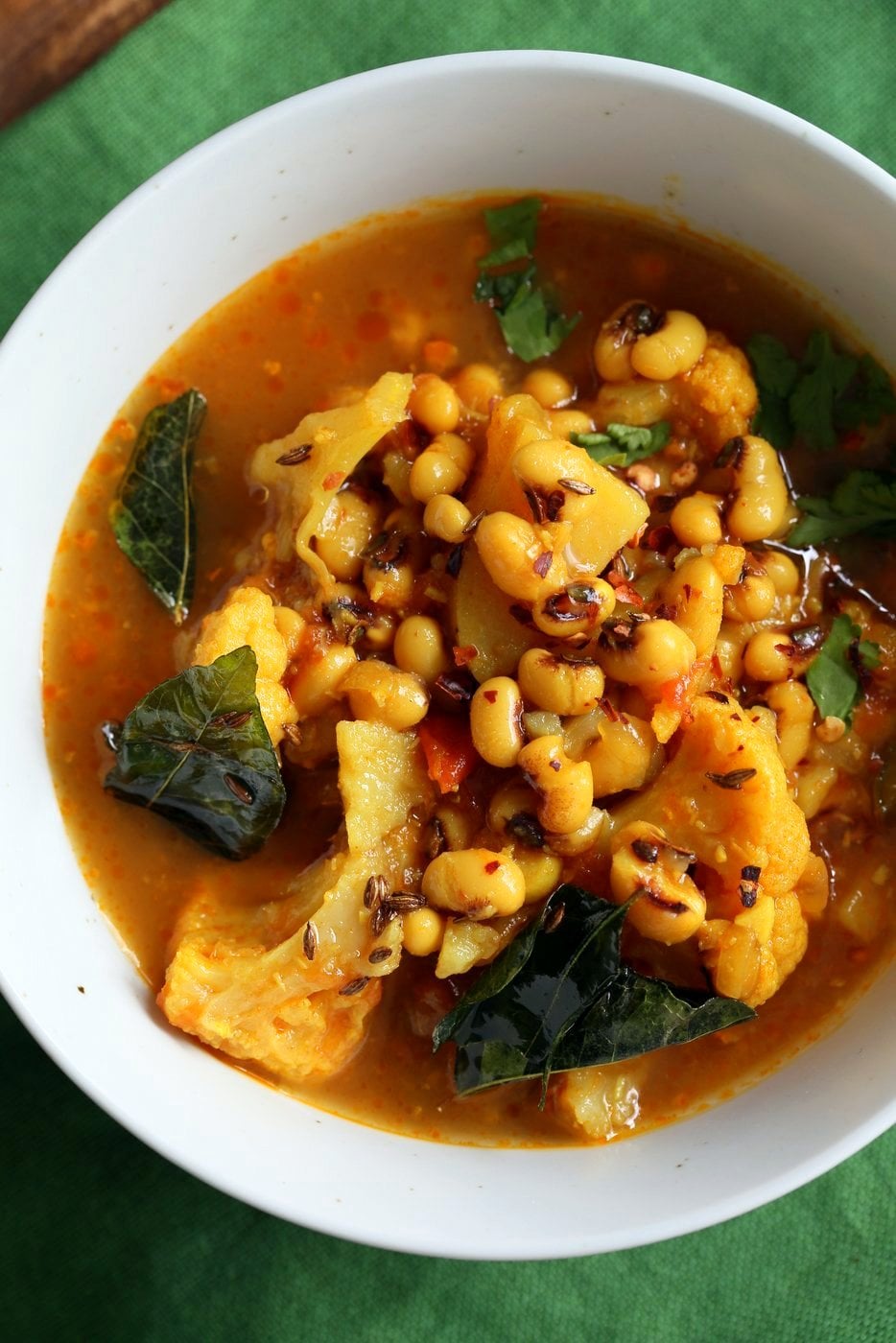 This coconutty Black Eyed Pea stew with Cauliflower and Potatoes is hearty and delicious. Instant Pot Black Eyed Pea Curry with vegetables. Saucepan Option. Vegetarian Black Eyed Peas Recipe | VeganRicha.com