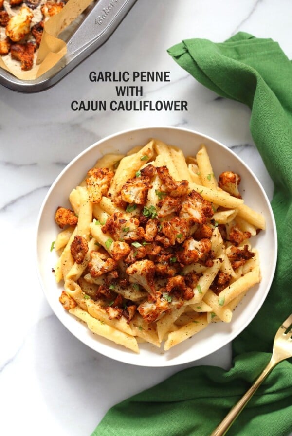 Vegan Garlic Pasta with Roasted Cajun Cauliflower. Cauliflower is tossed in homemade cajun spice blend and baked, then served over easy creamy Garlic sauce Penne Pasta. Vegan Recipe. Can be Nut-free gluten-free | VeganRicha.com