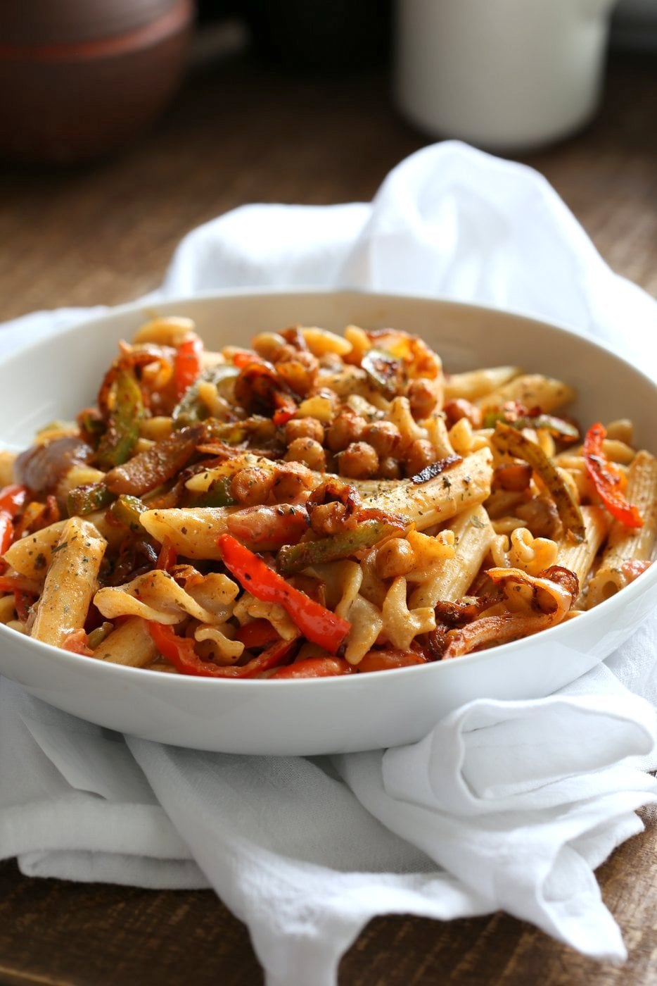 Vegan Fajita Pasta with Chickpeas and veggies. Easy Weeknight pasta with Taco seasoned veggies and beans mixed with creamy pasta. Vegan Soyfree Recipe. Can be gluten-free. #vegan #veganricha 