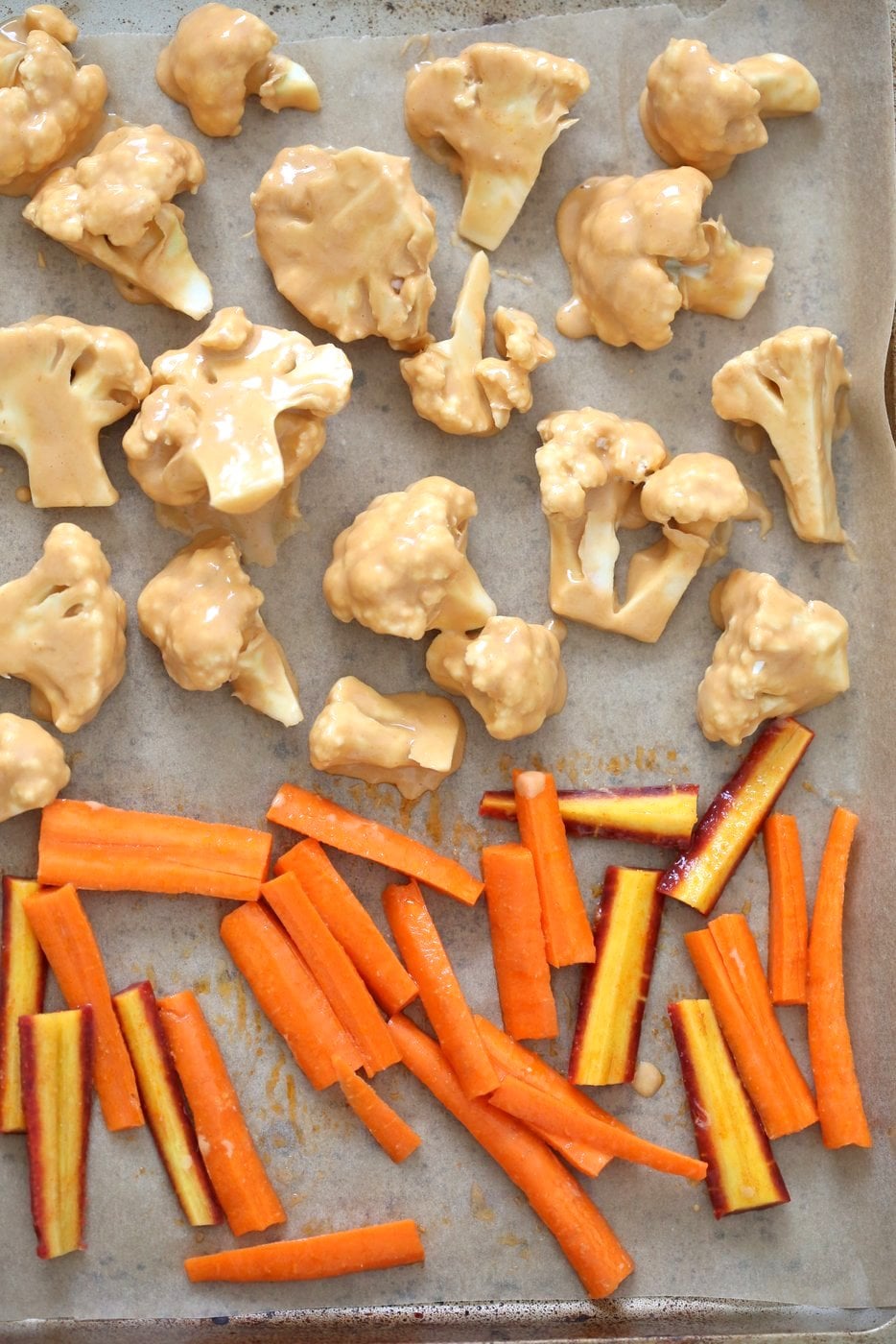 Peanut Butter Cauliflower Bowl with Roasted Carrots. Cauliflower tossed in peanut butter sauce and roasted, carrots tossed in hot sauce and roasted. Vegan Recipe, Gluten-free Recipe. | VeganRicha.com