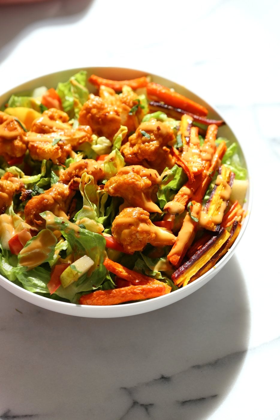 Peanut Butter Cauliflower Bowl with Roasted Carrots. Cauliflower tossed in peanut butter sauce and roasted, carrots tossed in hot sauce and roasted. Vegan Recipe, Gluten-free Recipe. | VeganRicha.com