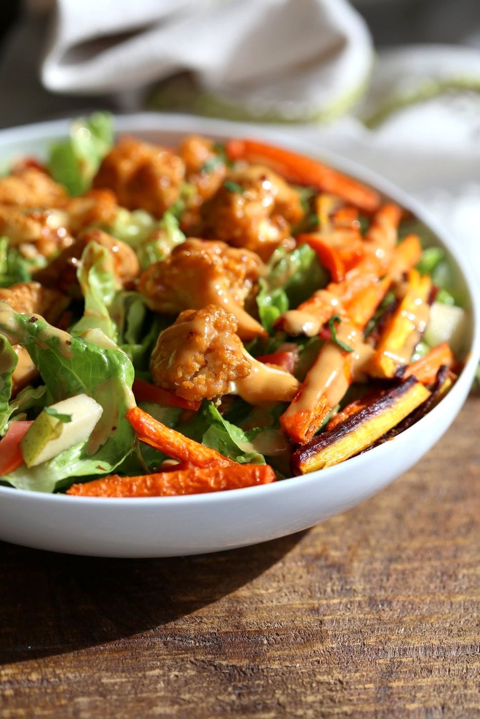 Peanut Butter Cauliflower Bowl with Roasted Carrots. Cauliflower tossed in peanut butter sauce and roasted, carrots tossed in hot sauce and roasted. Vegan Recipe, Gluten-free Recipe. | VeganRicha.com