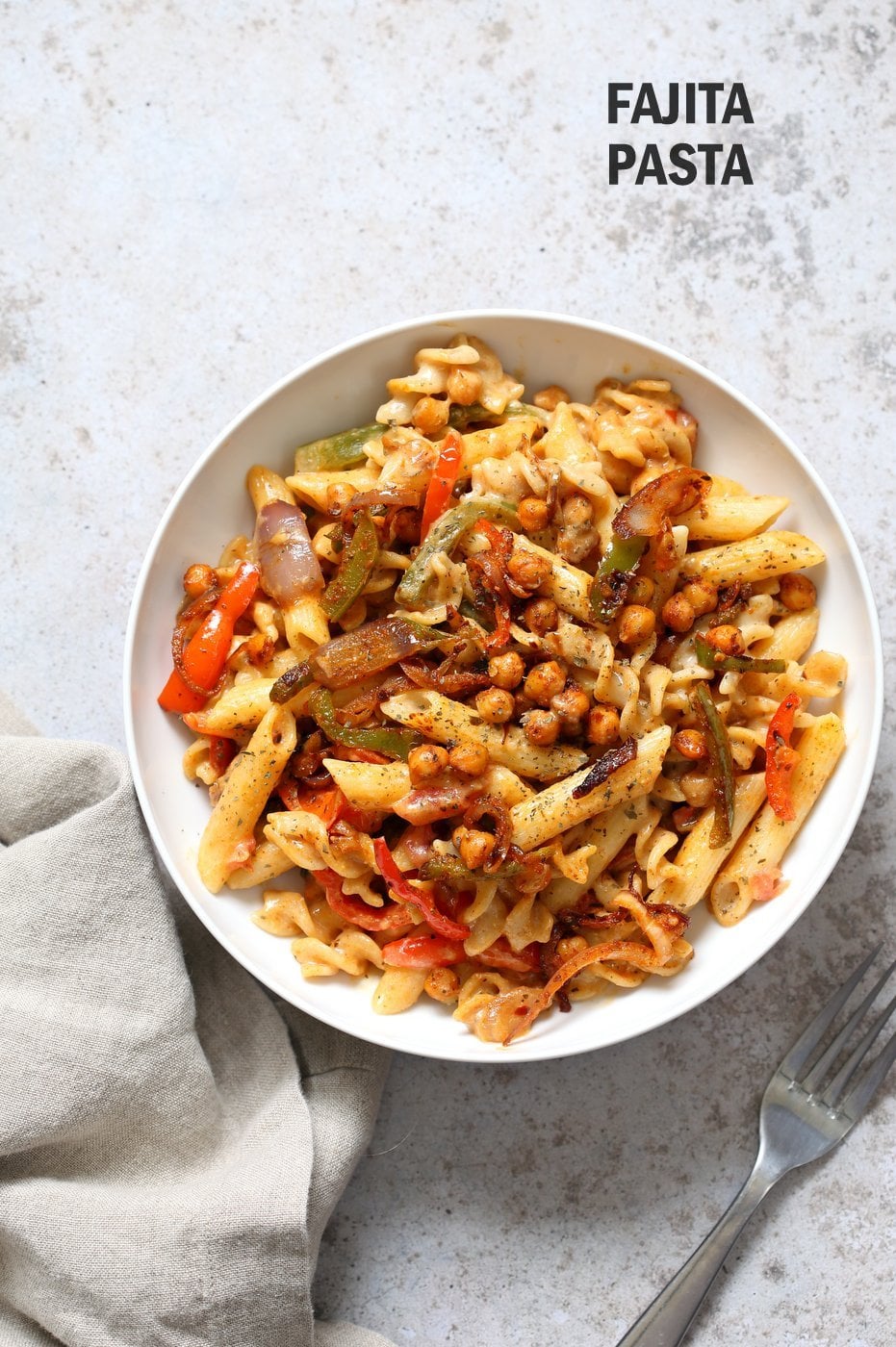 Vegan Fajita Pasta with Chickpeas and veggies. Easy Weeknight pasta with Taco seasoned veggies and beans mixed with creamy pasta. Vegan Soyfree Recipe. Can be gluten-free. #vegan #veganricha 