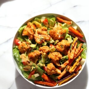 Peanut Butter Cauliflower Bowl with Roasted Carrots. Cauliflower tossed in peanut butter sauce and roasted, carrots tossed in hot sauce and roasted. Vegan Recipe, Gluten-free Recipe. | VeganRicha.com