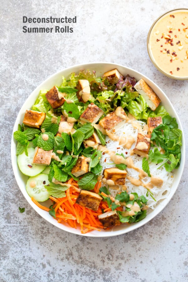 Crunchy Veggie Vegan Summer Rolls Deconstructed into a Bowl. Served with Peanut Butter Dipping Sauce. Fresh Spring Rolls/ Rice paper rolls in a bowl. Make a bowl, wrap or fill up rice paper wrappers. #Vegan #Glutenfree #Recipe #veganricha Use Sunbutter to make #nutfree | VeganRicha.comย