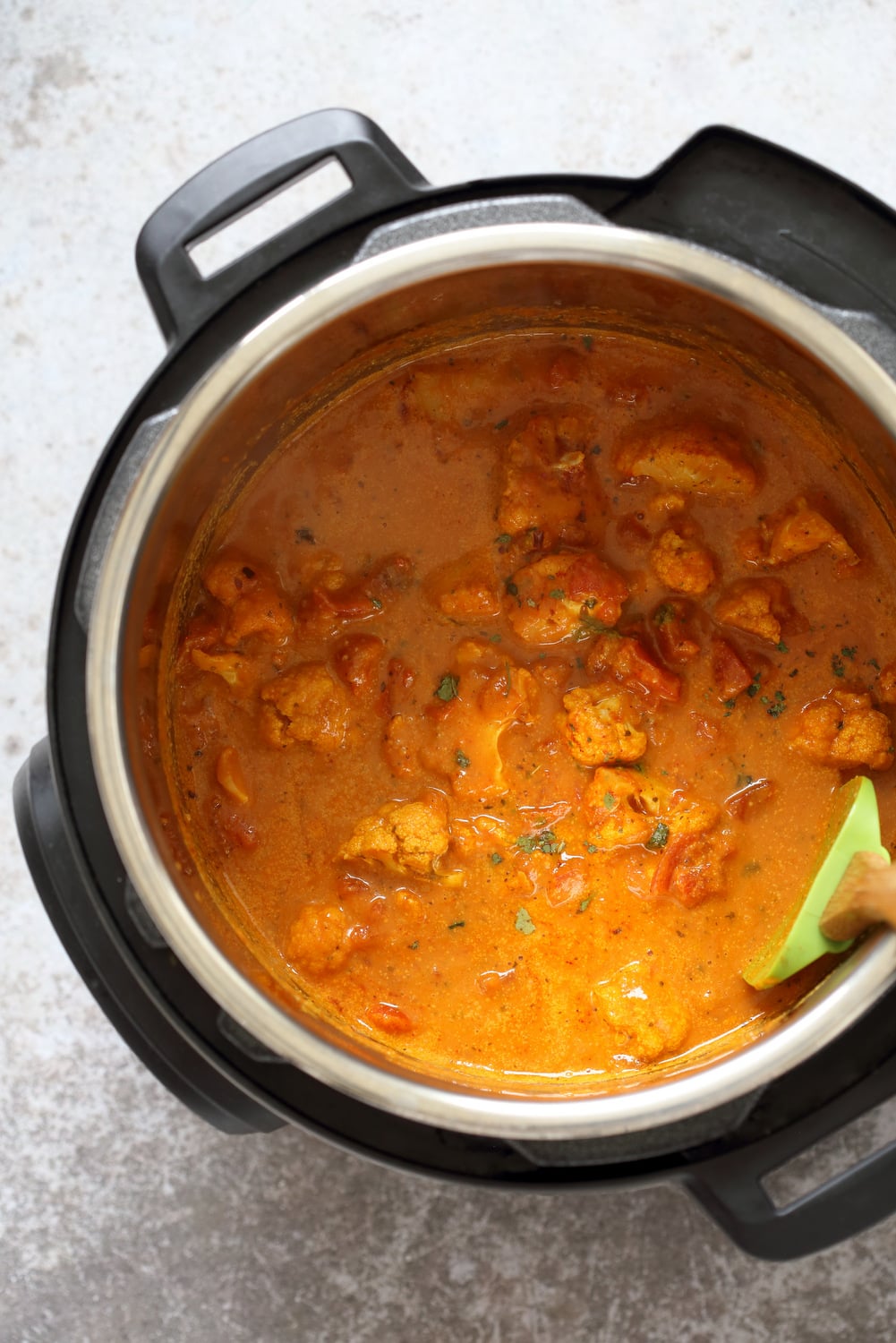 Baked Cauliflower Florets mixed into Tikka Masala Sauce in the Instant pot for our Vegan Cauliflower Tikka Masala