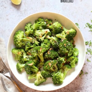 Sesame Garlic Broccoli needs just 6 ingredients. It is vibrant with blanched broccoli and delicious with a simple dressing of garlic roasted with sesame oil. A perfect side. #Vegan #glutenfree #soyfree #nutfree #veganricha #recipe
