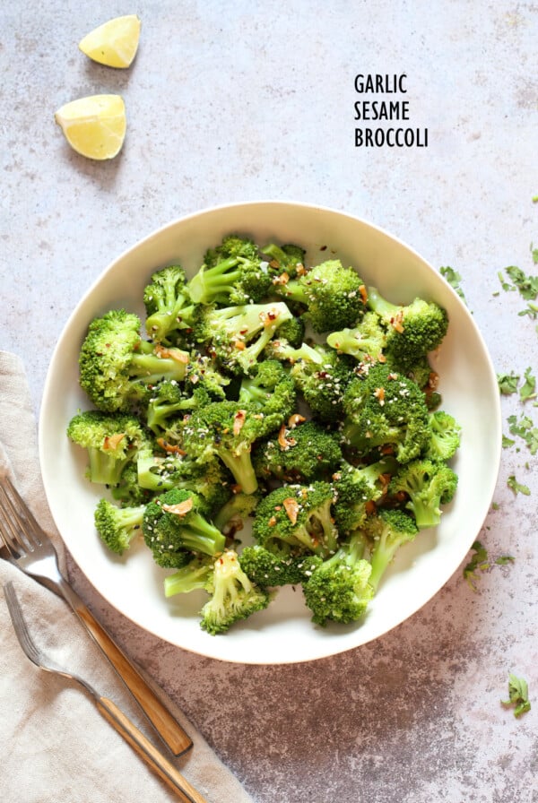 Sesame Garlic Broccoli needs just 6 ingredients. It is vibrant with blanched broccoli and delicious with a simple dressing of garlic roasted with sesame oil. A perfect side. #Vegan #glutenfree #soyfree #nutfree #veganricha #recipeย