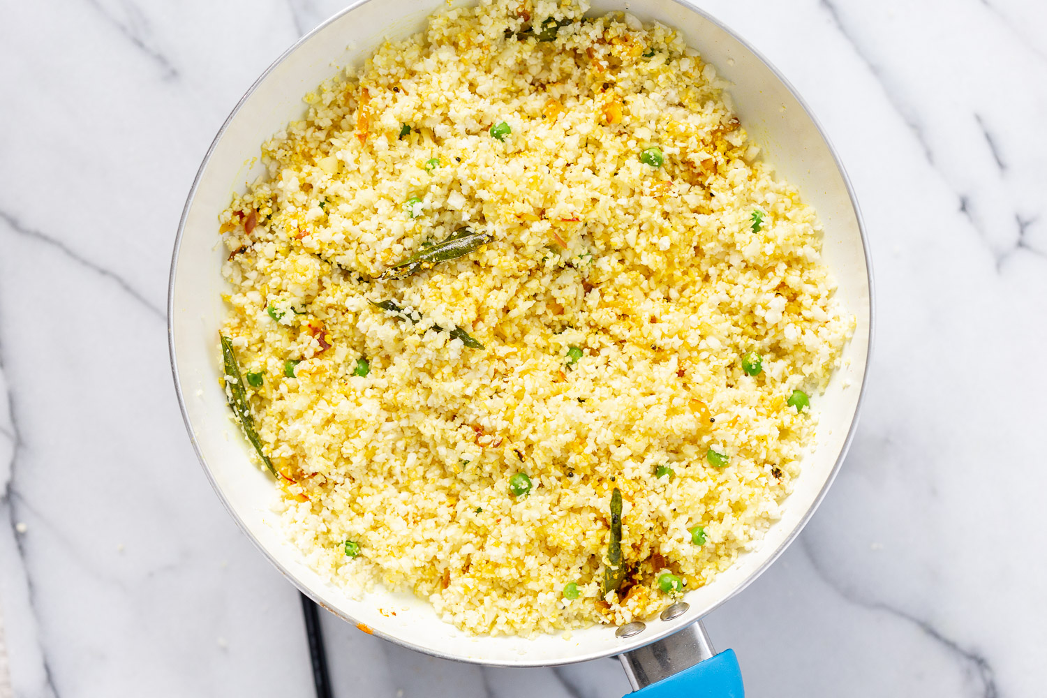 Our Turmeric Cauliflower Rice Process steps in White skillet