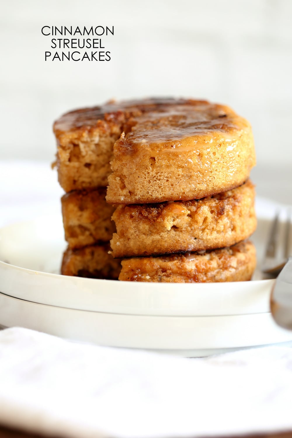 These Vegan Cinnamon Streusel Pancakes are a perfect treat for Valentines or a special day. A delicious fluffy vanilla pancake topped with a cinnamon streusel for a coffee cake like pancake. Make the pancakes in cookie cutters to make a cake like pancake tower! #Vegan #Pancakes #Soyfree #Nutfree #Recipe #VeganRicha