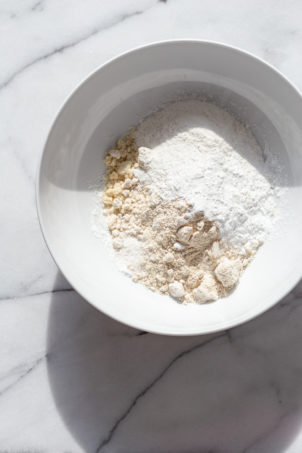 Our Vegan Gluten free Vanilla Cake ingredients in a white bowl