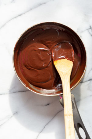 Chocolate frosting in a skillet for Our Vegan Gluten free Vanilla Cake