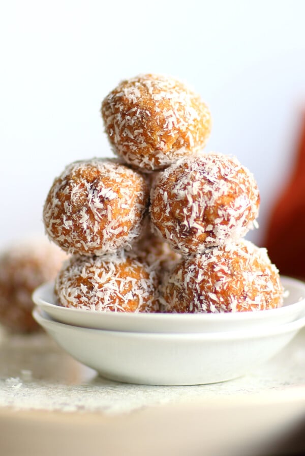Easyย Vegan Carrot Cake Bites Recipe! These Spiced Nut and Carrot Cake Balls Need just 8 ingredients and 15 minutes. Grainfree Carrot Cake Bliss Balls. Roll in coconut or dress with vegan cream cheese glaze. #CarrotCakeBites #Vegan #Glutenfree #Grainfree #Soyfreeย #healthy #VeganRicha VeganRicha.com