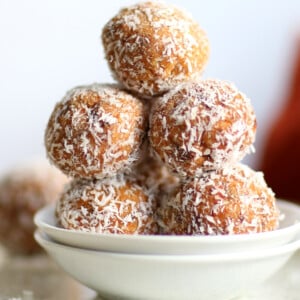 Easy Vegan Carrot Cake Bites Recipe! These Spiced Nut and Carrot Cake Balls Need just 8 ingredients and 15 minutes. Grainfree Carrot Cake Bliss Balls. Roll in coconut or dress with vegan cream cheese glaze. #CarrotCakeBites #Vegan #Glutenfree #Grainfree #Soyfree #healthy #VeganRicha VeganRicha.com