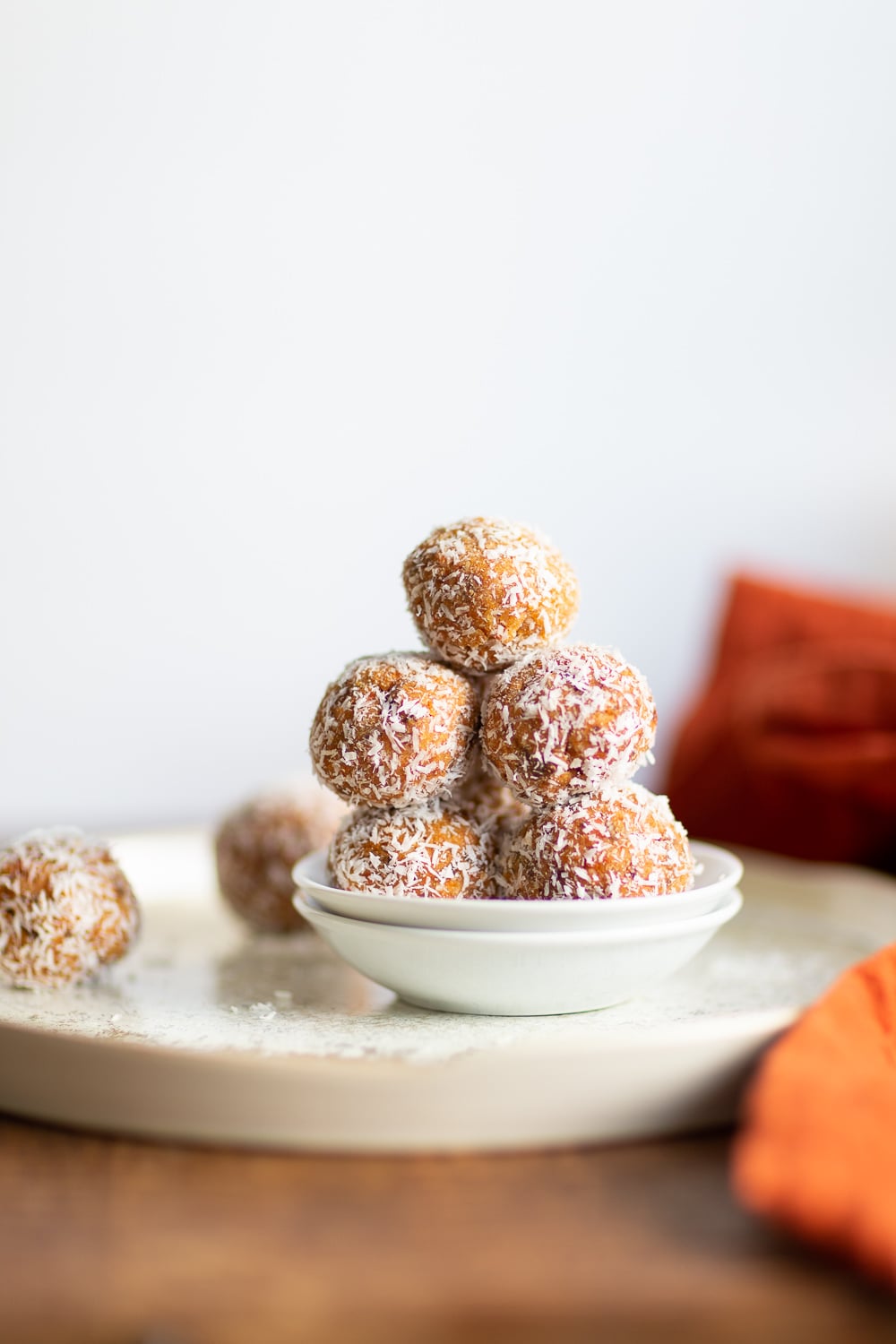 Easy Vegan Carrot Cake Bites Recipe! These Spiced Nut and Carrot Cake Balls Need just 8 ingredients and 15 minutes. Grainfree Carrot Cake Bliss Balls. Roll in coconut or dress with vegan cream cheese glaze. #CarrotCakeBites #Vegan #Glutenfree #Grainfree #Soyfree #healthy #VeganRicha VeganRicha.com