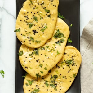 Vegan Gluten free Naan Flatbread. Grain-free Naan Recipe. 6 Main Ingredients, 1 Bowl, and 20 Minutes. Serve with curries or slice and serve with dips or add to bowls. Soyfree Nutfree options #Vegan #Glutenfree #grainfree #Veganricha #glutenfreenaan #grainfreenaan #chickpeaflournaan