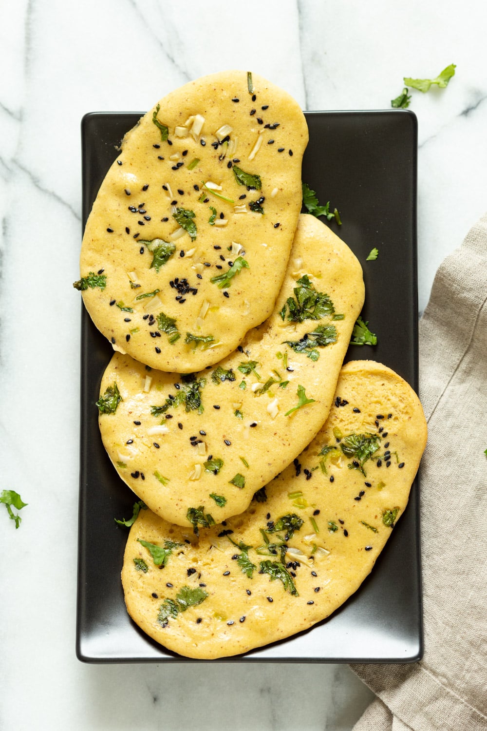 Vegan Gluten free Naan Flatbread. Grain-free Naan Recipe. 6 Main Ingredients, 1 Bowl, and 20 Minutes. Serve with curries or slice and serve with dips or add to bowls. Soyfree Nutfree options #Vegan #Glutenfree #grainfree #Veganricha #glutenfreenaan #grainfreenaan #chickpeaflournaan