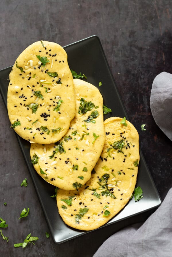 Vegan Gluten free Naan Flatbread. Grain-free Naan Recipe. 6 Main Ingredients,ย 1 Bowl, and 20 Minutes. Serve with curries or slice and serve with dips or add to bowls. Soyfree Nutfree options #Vegan #Glutenfree #grainfree #Veganricha #glutenfreenaan #grainfreenaan #chickpeaflournaan