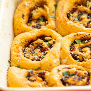 Vegan Pizza Rolls. Easy Pizza dough stuffed with herbed mushroom tomato filling, rolled, sliced and baked. Delicious snack or appetizer! #Vegan #Soyfree #Nutfree #Recipe #Veganpizzarolls #VeganRicha
