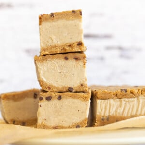 These Vegan Cookie Dough Ice Cream Sandwiches use a quick oat flour cookie dough with coconut milk vanilla ice cream base all homemade. No Baking, no ice cream machine needed. Glutenfree Soyfree Recipe.