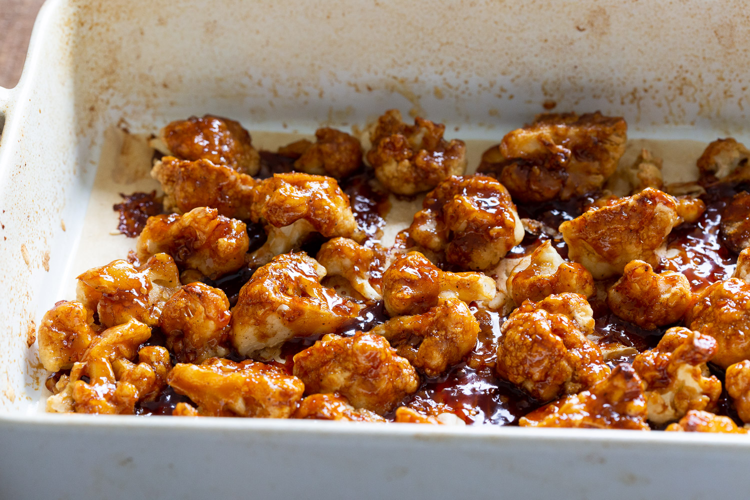Vegan Sticky Sesame Cauliflower glazed in a baking dish