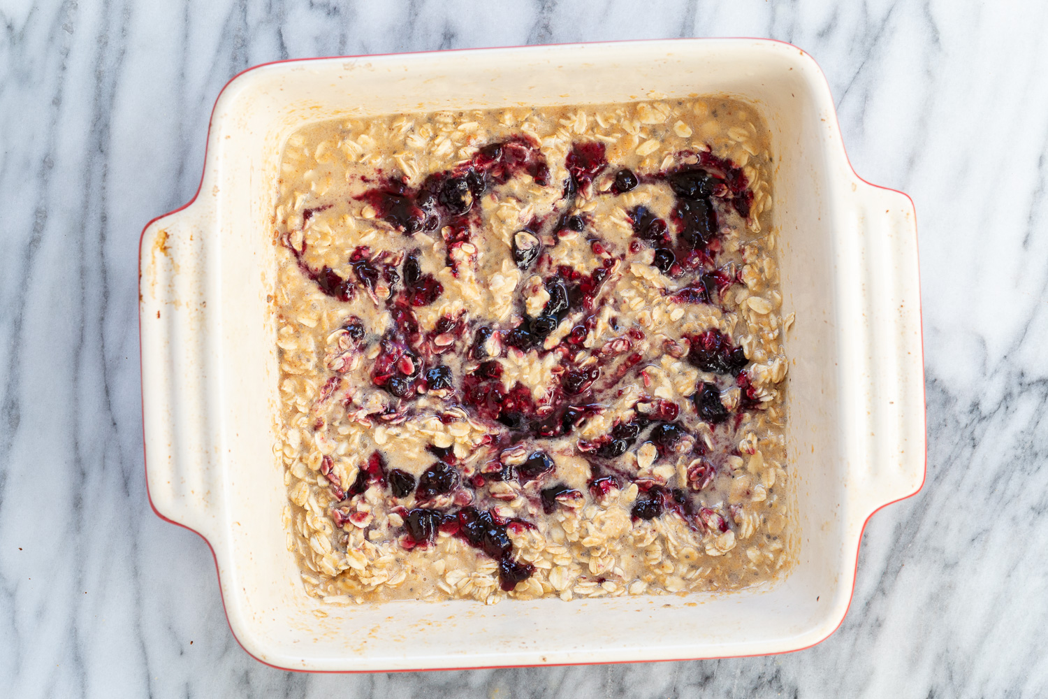 Peanut Butrer And Jelly Oatmeal in a white baking dish