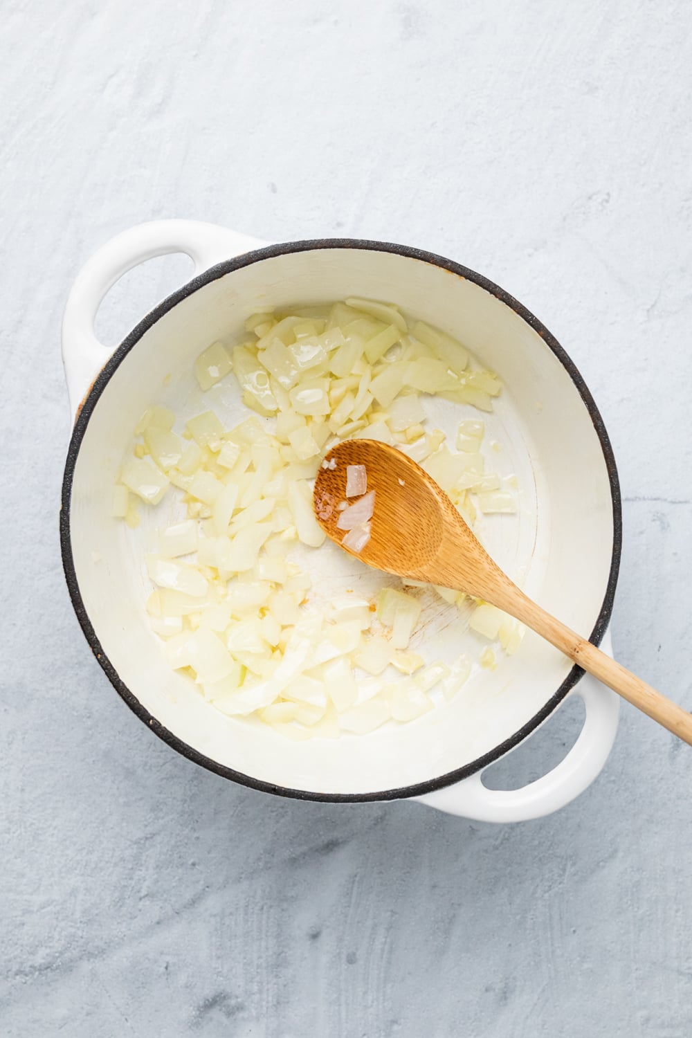 sweet potato curry onions being sauteed in a pot