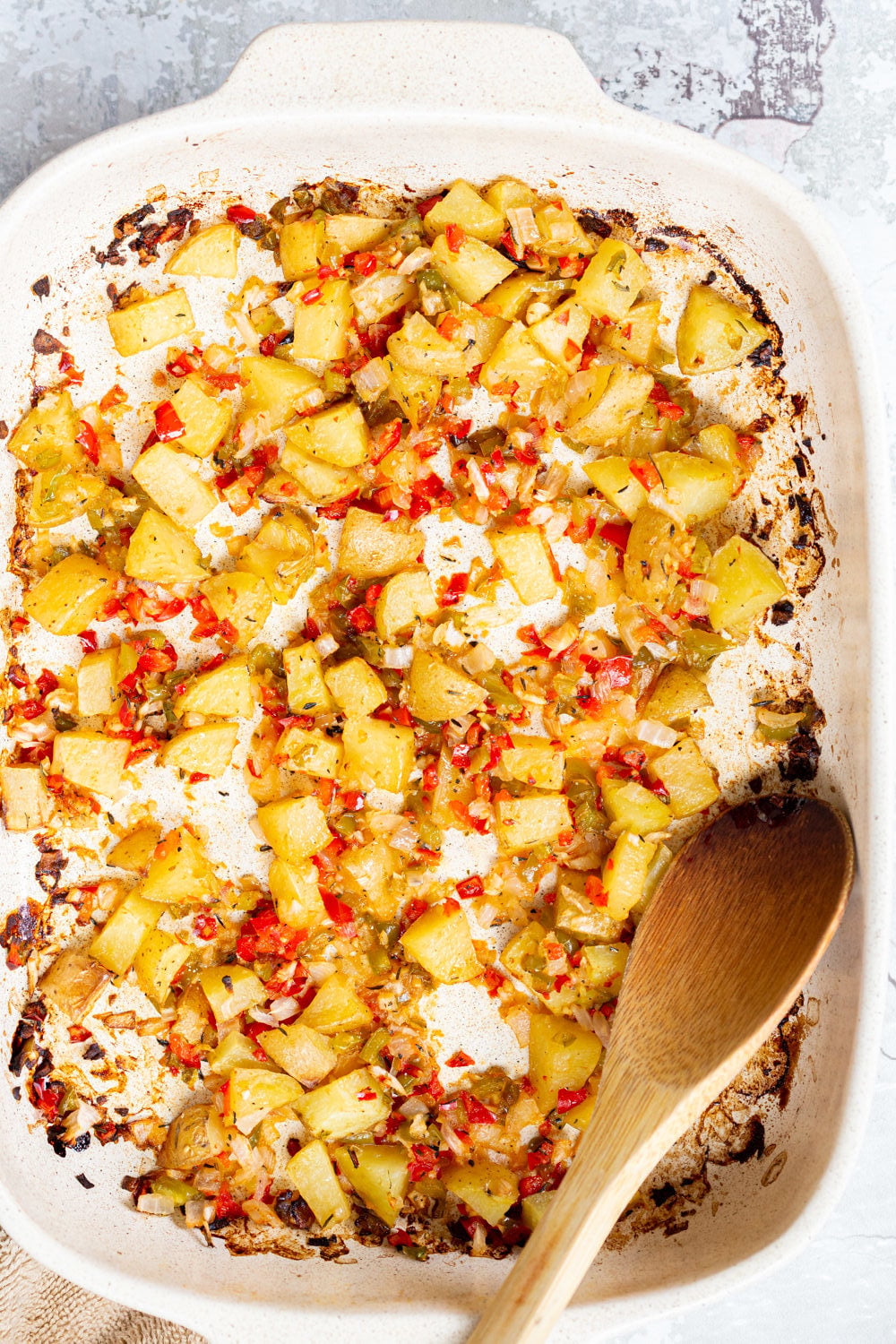 easy vegan baked Breakfast Potatoes in a white baking dish