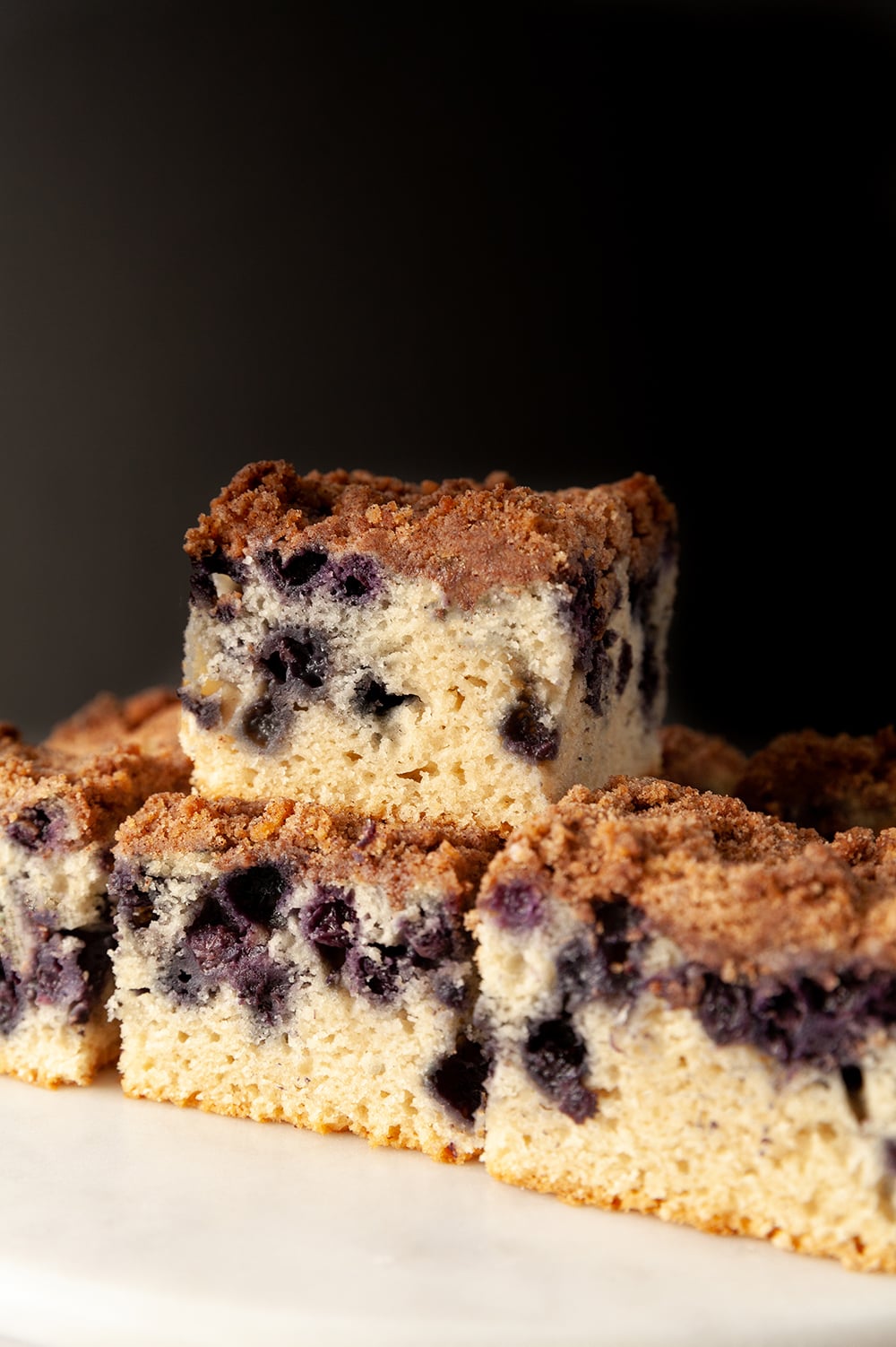 eggless cake eggless lemon blueberry sheet cake against a black background