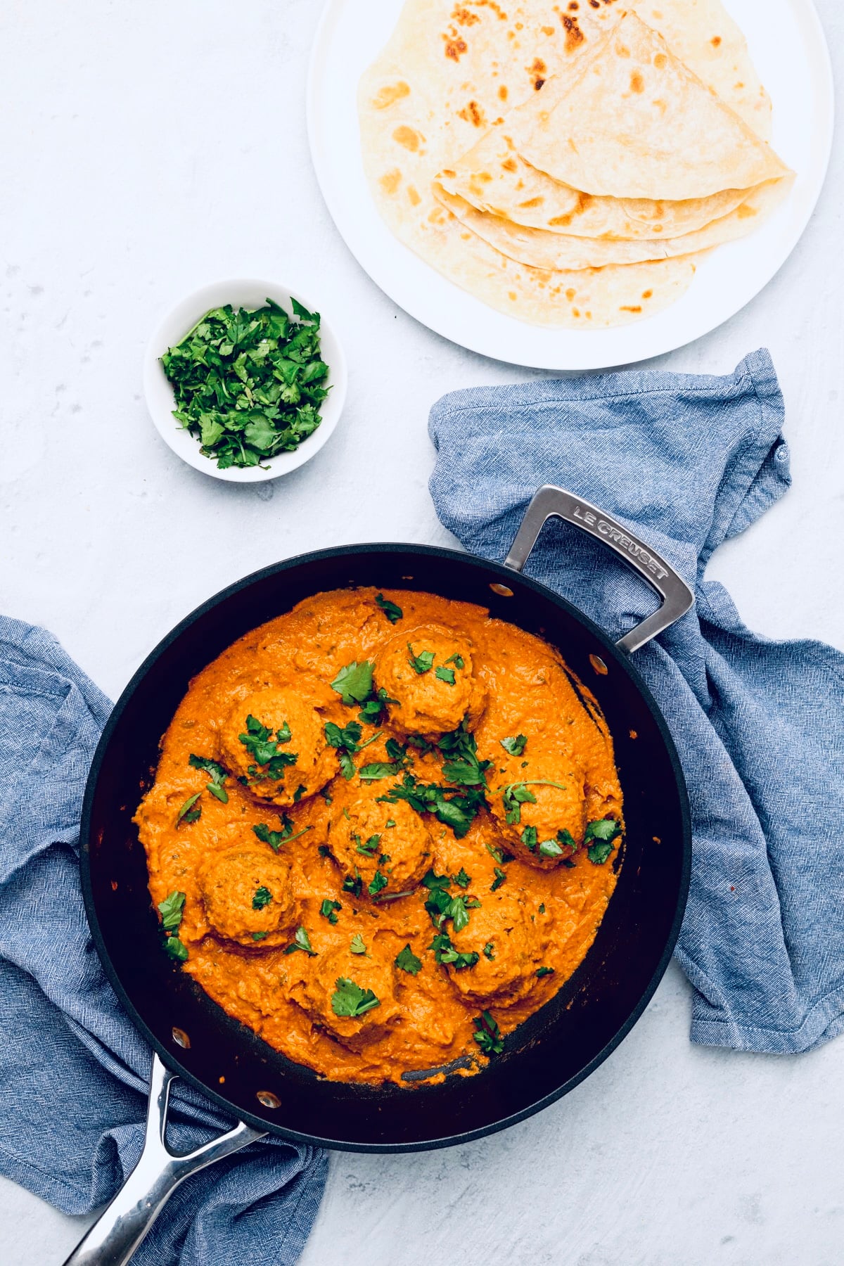 overhead shot of vegan malai kofta in a black skillet 