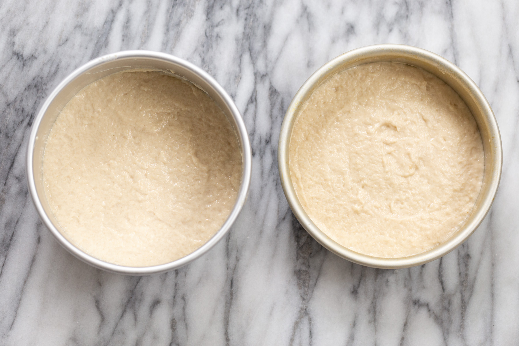 vegan white cake vegan white cake batter in two springform pans