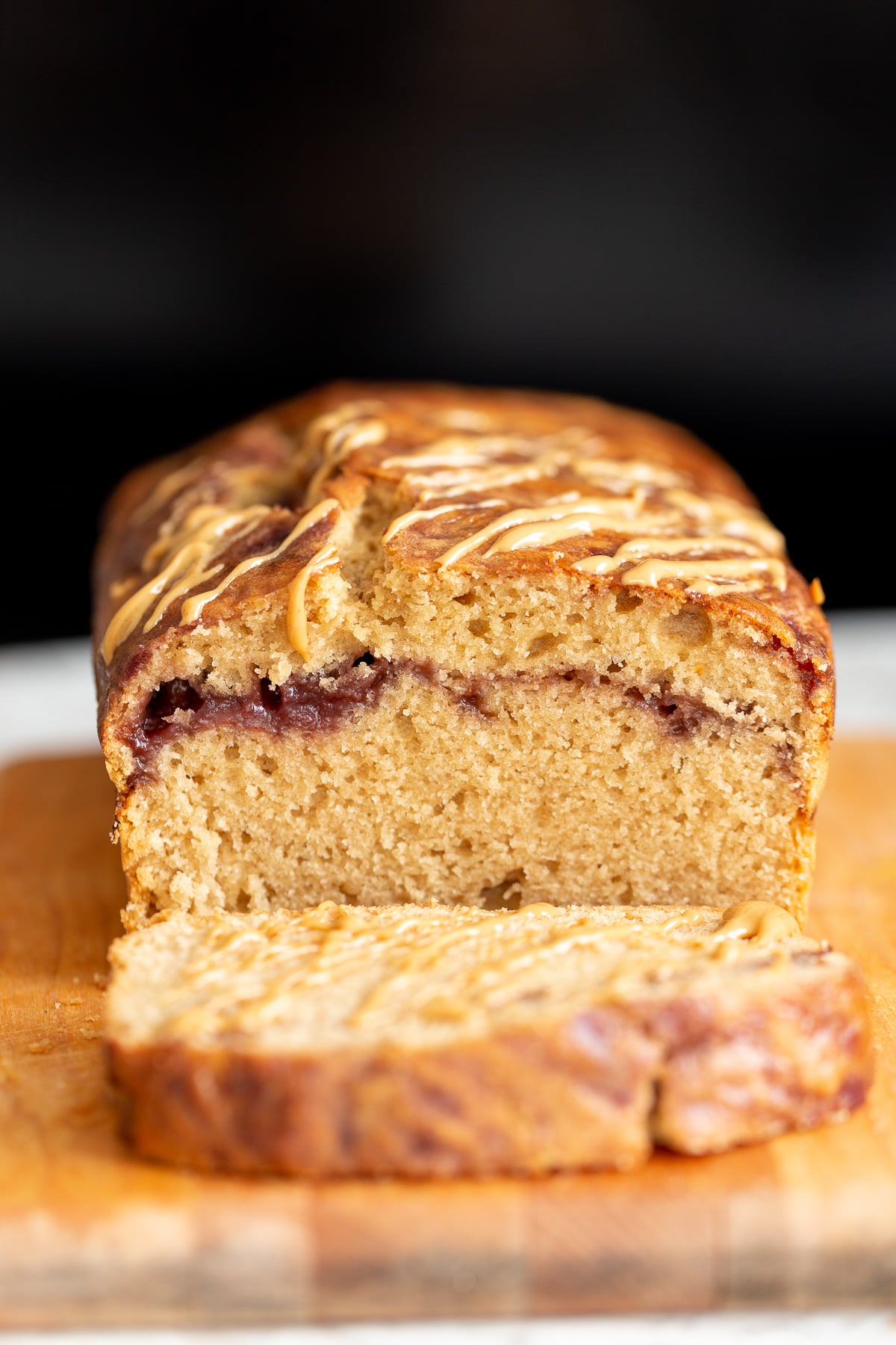 peanut butter and jelly cake a sliced vegan peanut butter and jelly cake baked in a loaf pan
