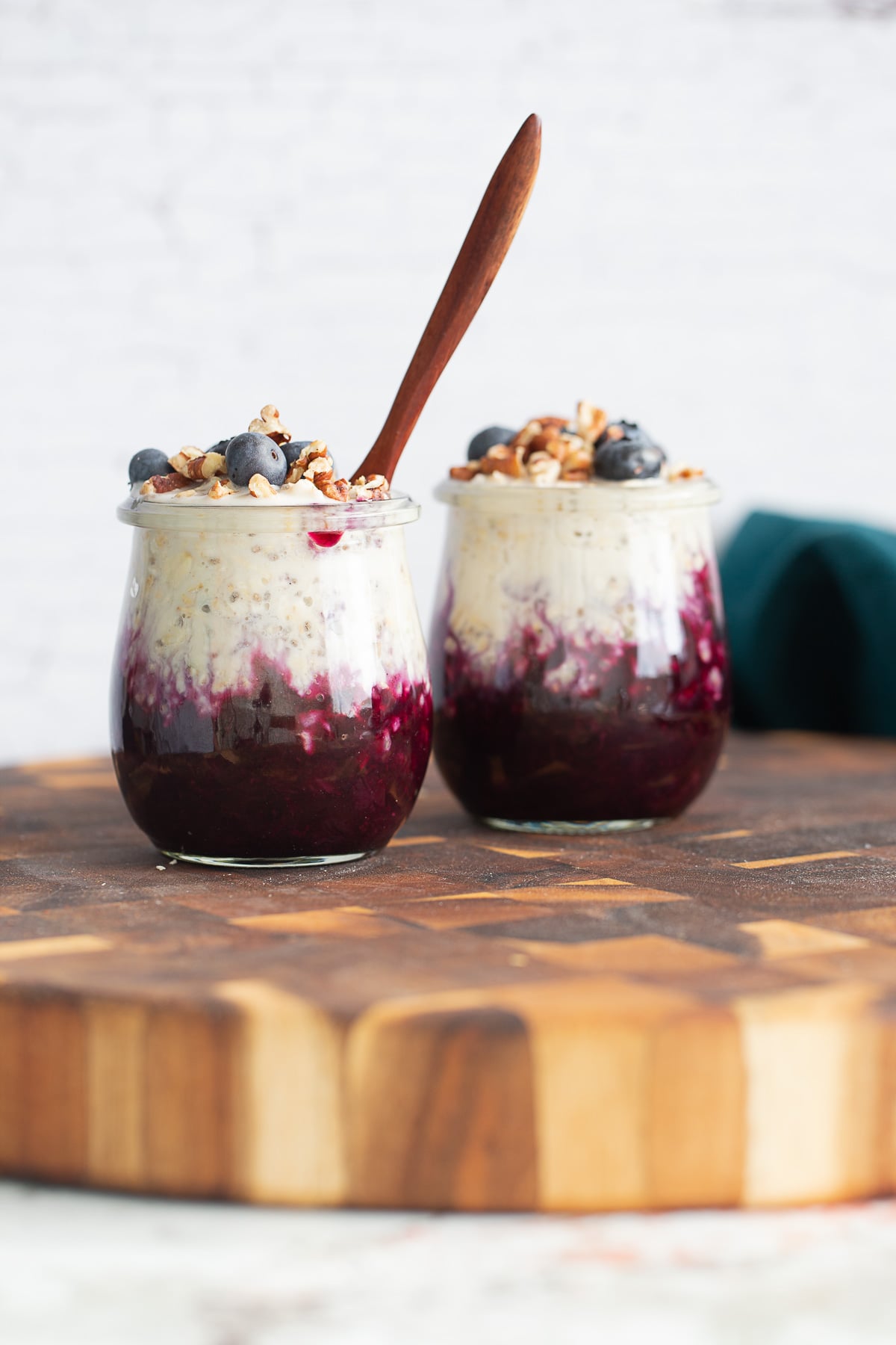 blueberry overnight oats blueberry muffin overnight oats topped with blueberries and chopped pecans