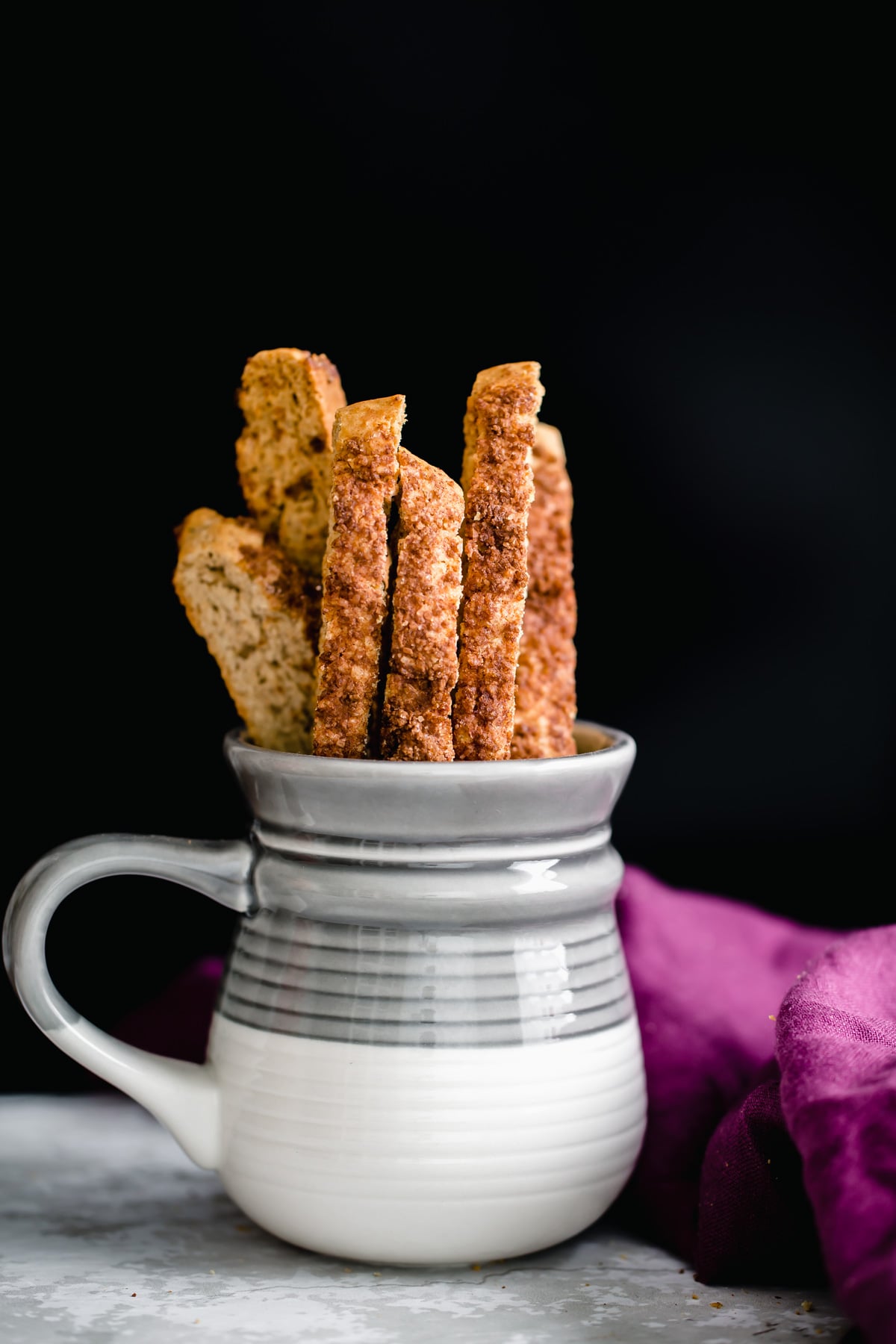a coffee mug with vegan cinnamon sugar biscotti 
