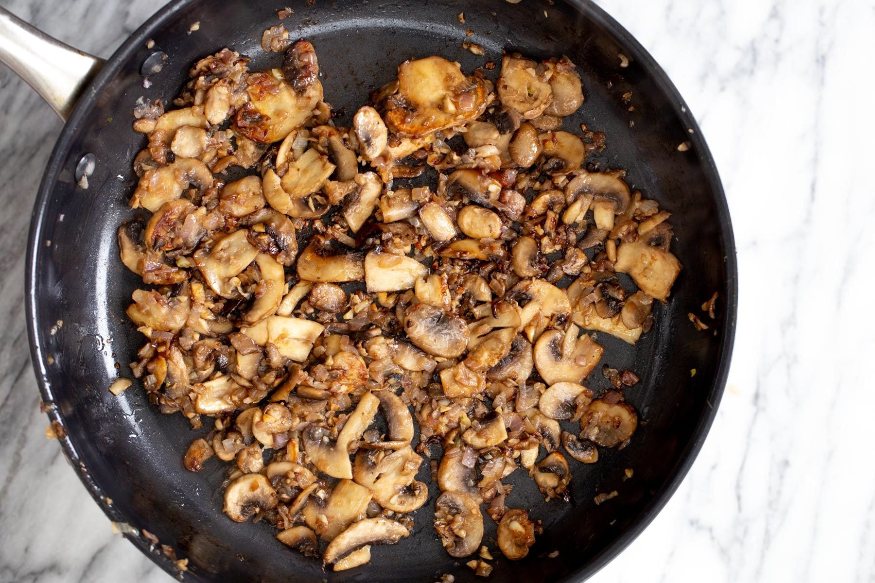 sauteed mushrooms in a frying pan