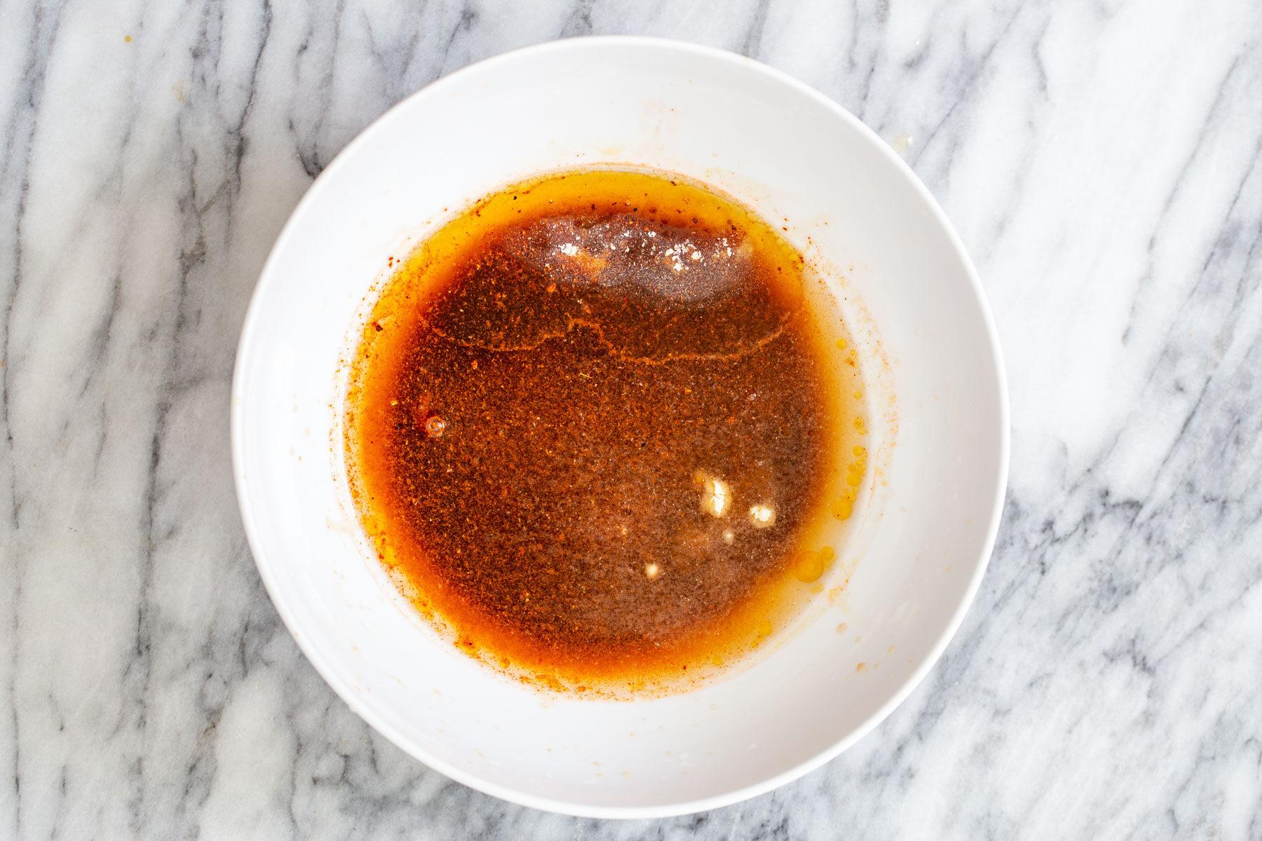 Korean Gochujang marinade in a white bowl