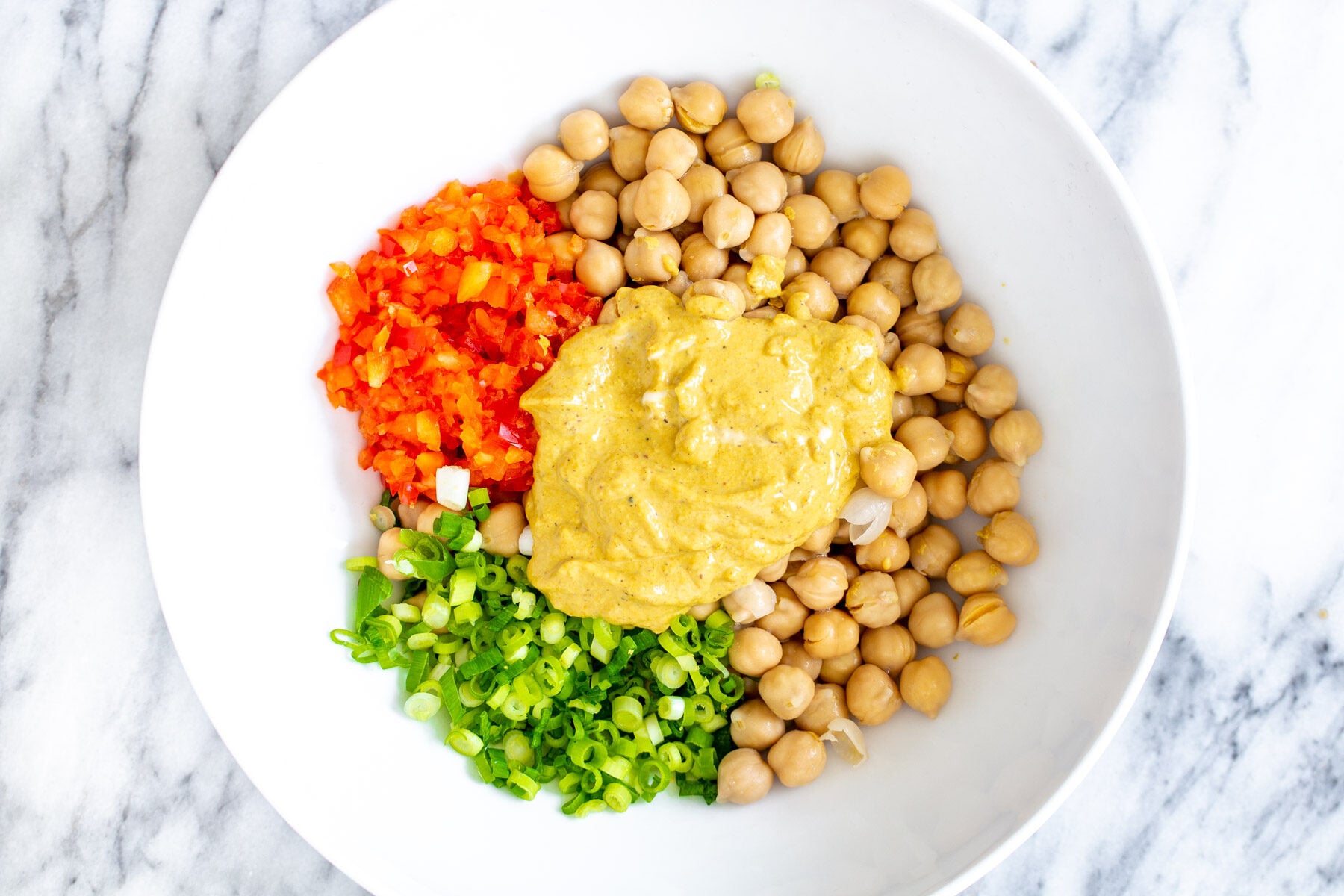 chickpea breakfast ingredients for vegan chickpea scramble in a white bowl