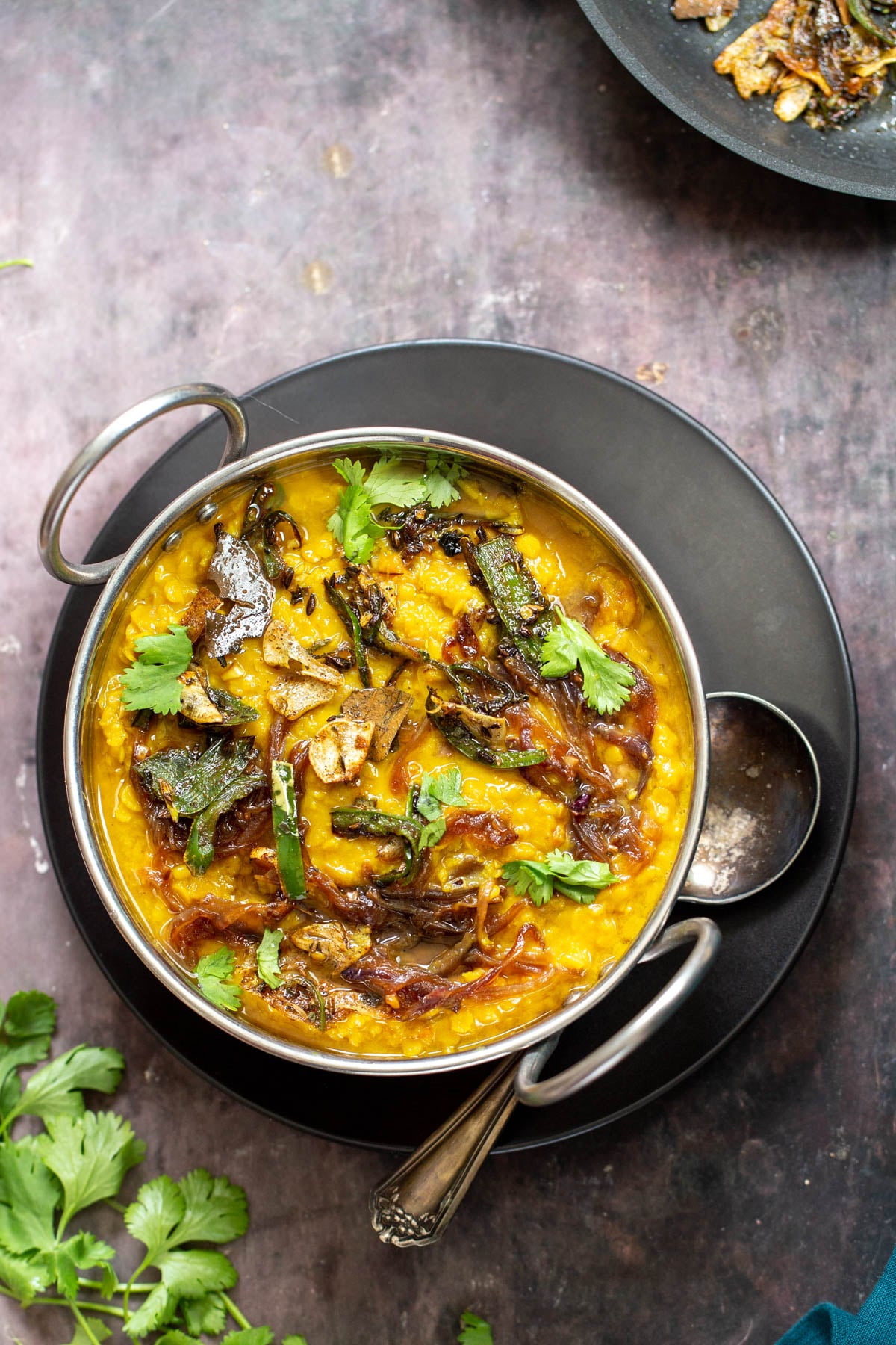 masoor dal tadka Restaurant-Style Masoor Dal Tadka in an Indian serving dish
