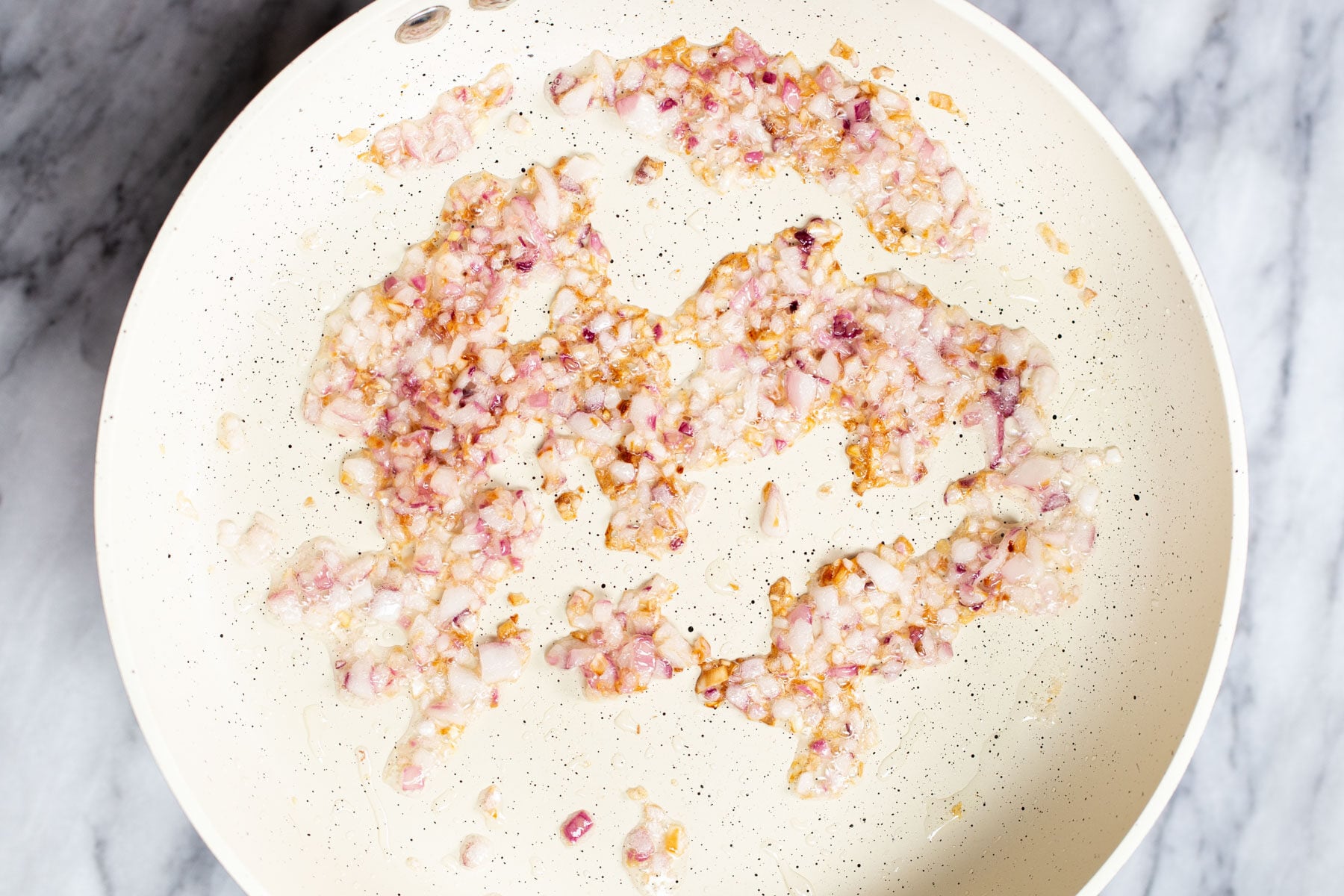 sauteeing pan with diced fried red onions