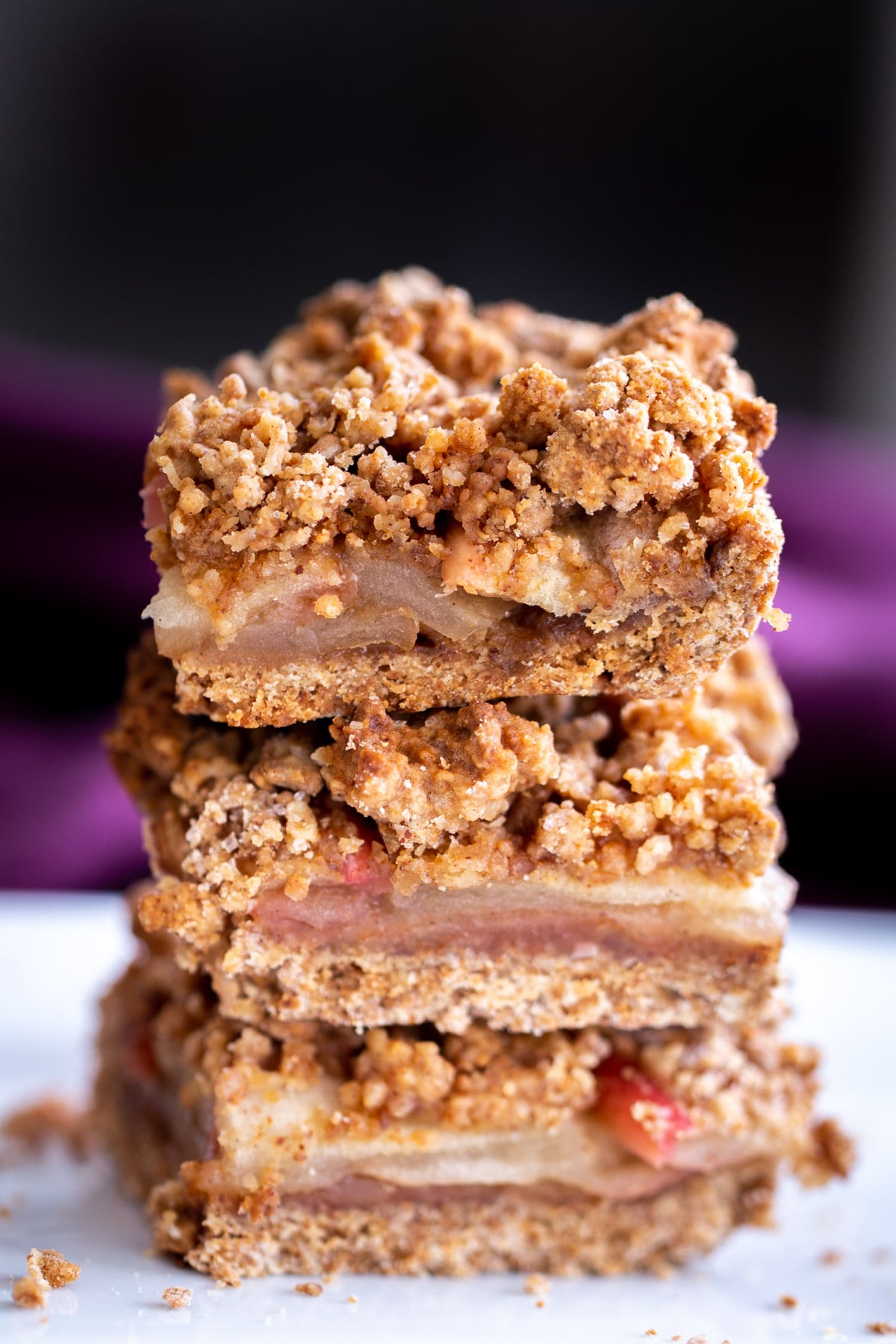 a stack of vegan apple pie crumble bars 