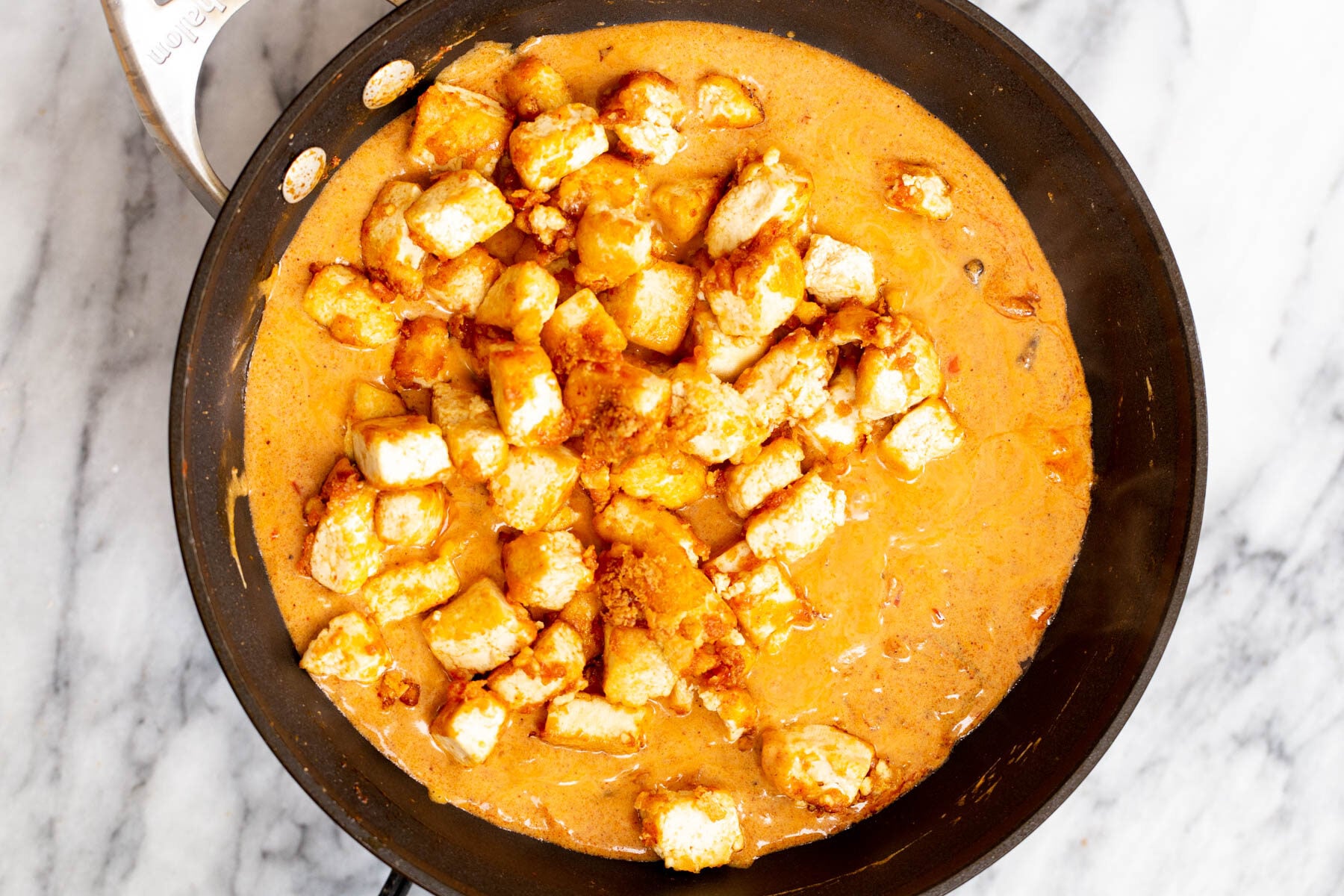 tofu cubes in a creamy vegan sauce