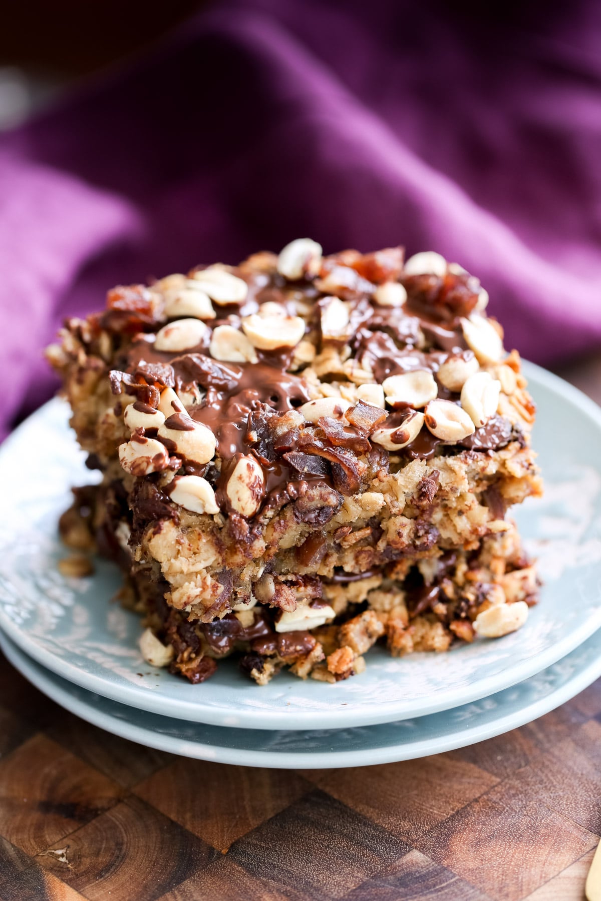 two stacked squares of vegan snickers baked oatmeal 