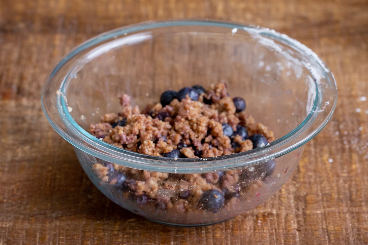 blueberry streusel dough in a glass bowl