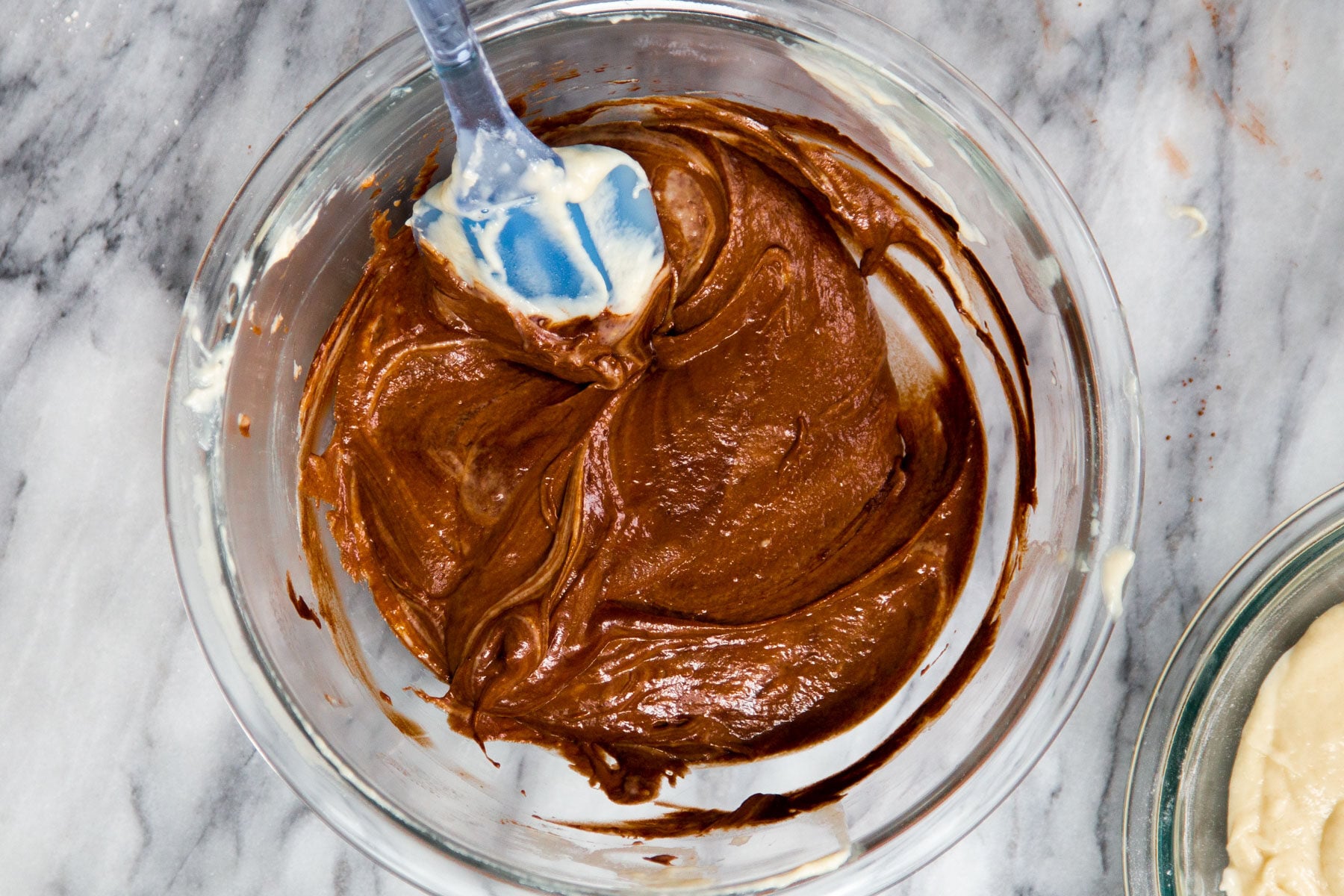 mocha cake batter in a glass bowl 
