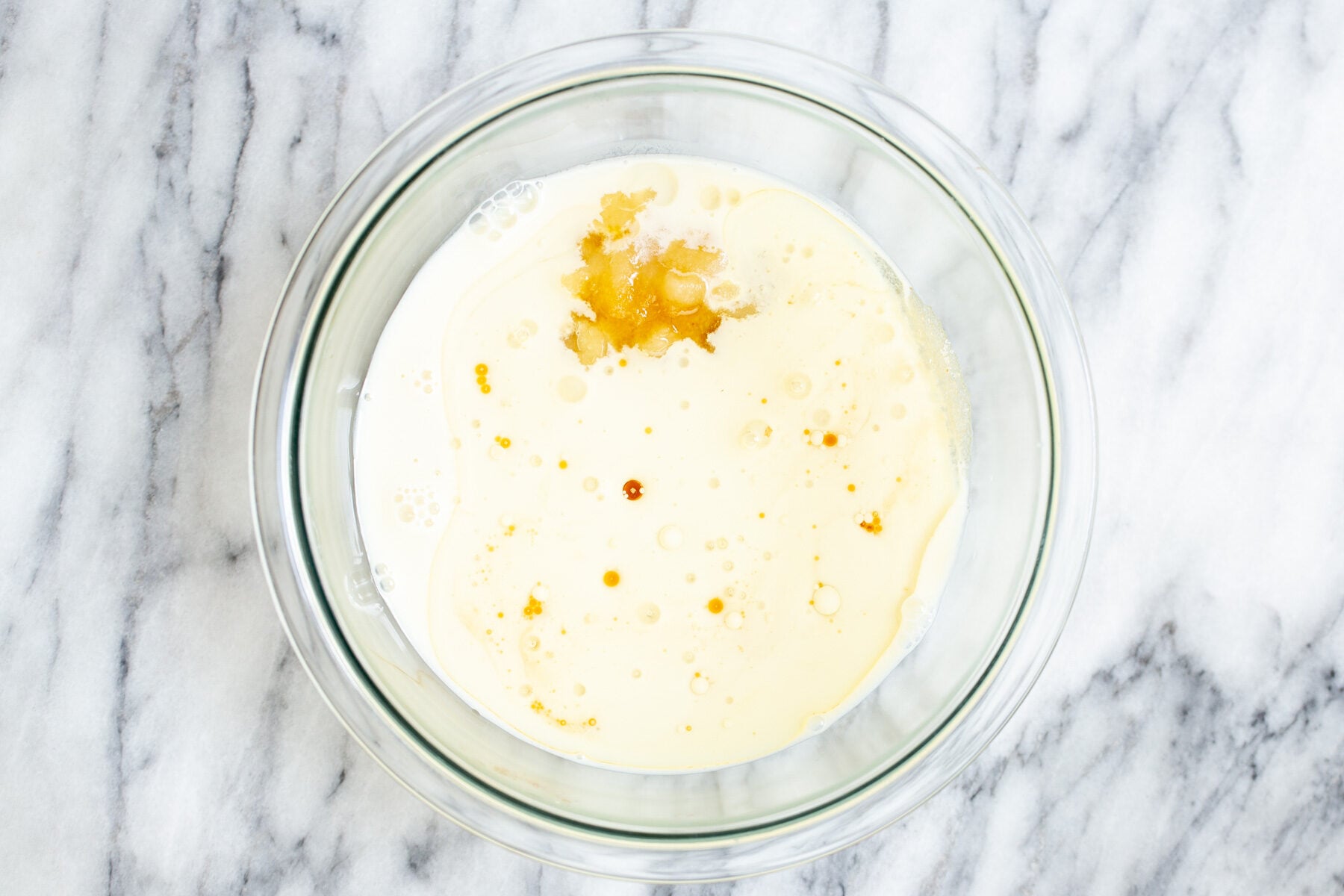 wet ingredients for baklava cake in a glass bowl 